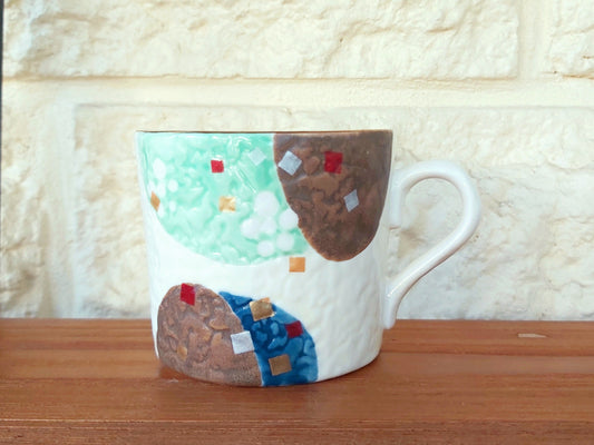 Abstract painting on a textured fine porcelain coffee cup. Japanese.